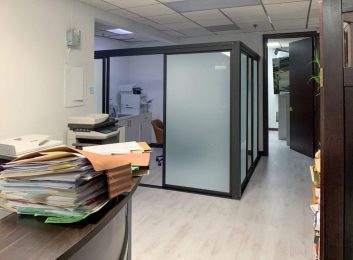 Glass office partitions, black frames, frosted glass, 160\"W x 80\"H, $2335