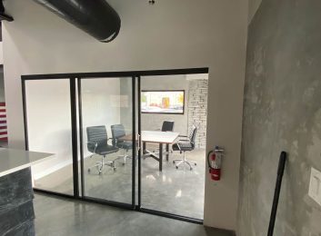 Glass home office, black frames, clear glass, Trio Design, 108x80, $1,680